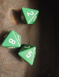 Three standard green eight-sided dice.
